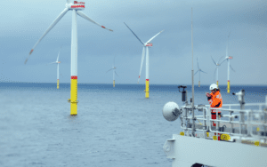 Wind turbine technician inspecting pylons