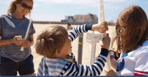 Children putting together model wind turbine
