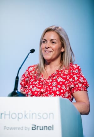 Taylor Hopkinson Head of HR Vikki Craig talks at an employee conference in 2023.