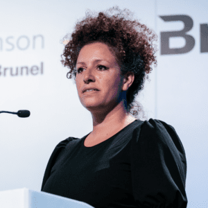 Fiona McRae, Managing Director at Taylor Hopkinson, speaks on stage at a conference.