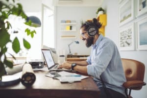 Renewable energy specialist listening to sustainable energy podcast while at work