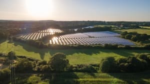 Aerial view of solar solar farm in evening sun light.