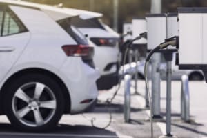 Charging stations for electric cars at a car park. Taylor Hopkinson is a specialist recruiter providing energy storage and electrical infrastructure experts to the world's leading electric vehicle charging companies.